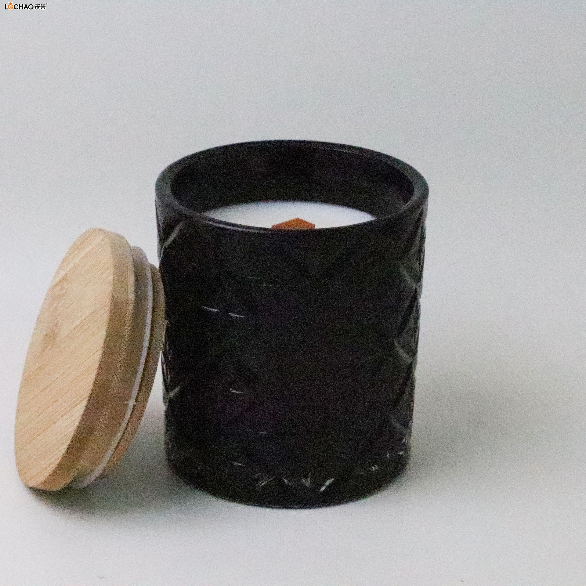 Embossed glass bottle scented candle