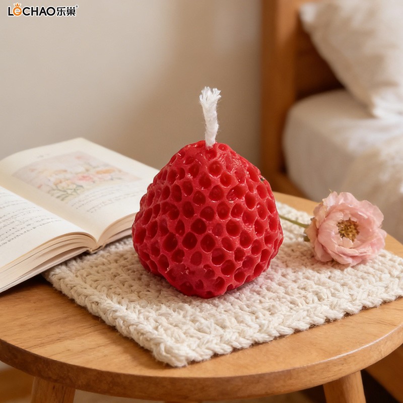 Strawberry-shaped fragrance candle